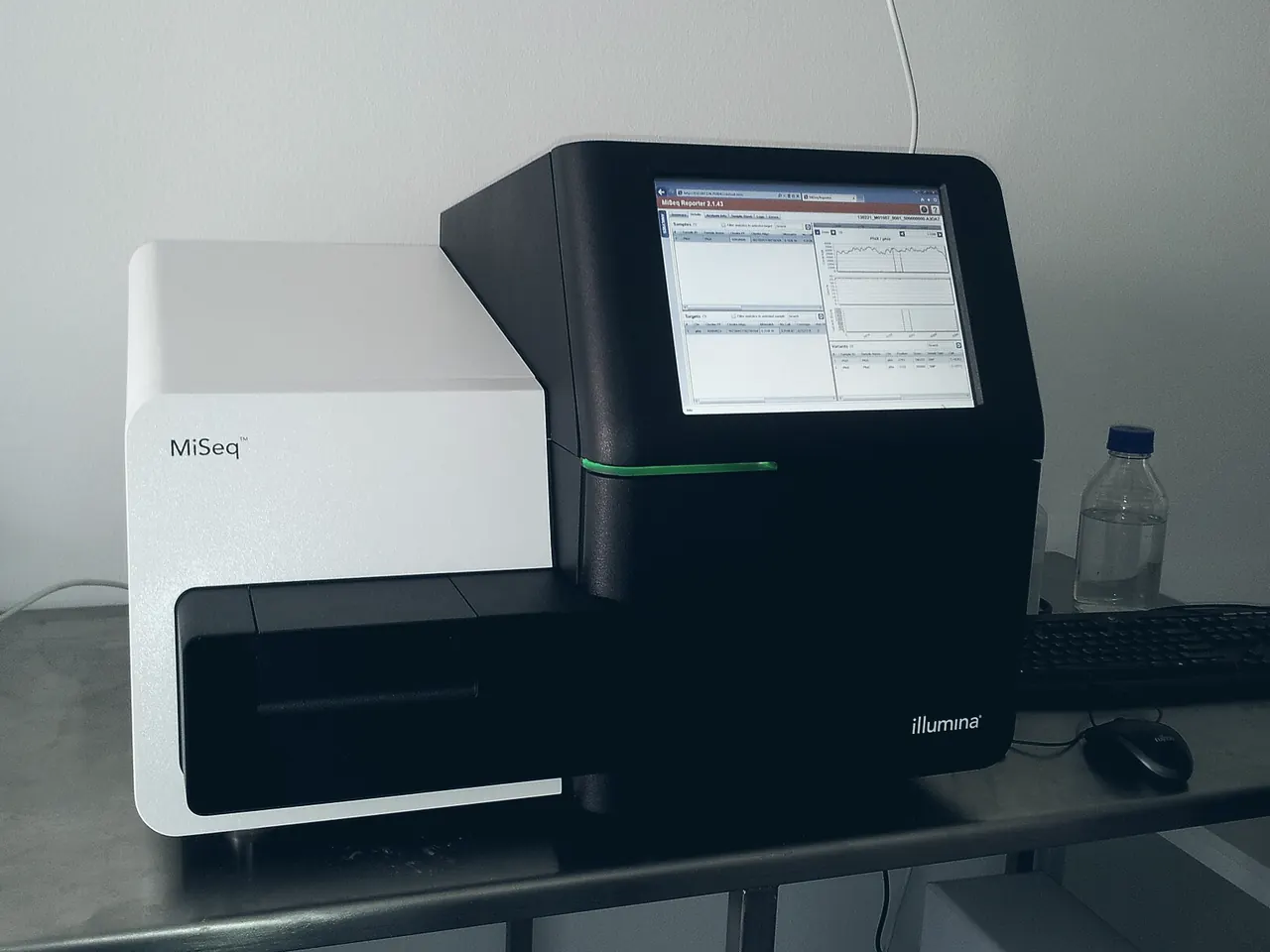 Benchtop Illumina MiSeq sequencer on a laboratory bench